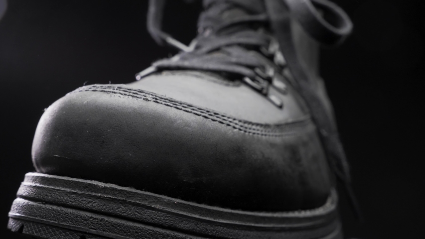 A waterproof spray is applied to the shoes