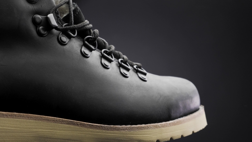 A waterproof spray is applied to the shoes