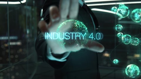 Businessman with Industry 4.0 hologram concept