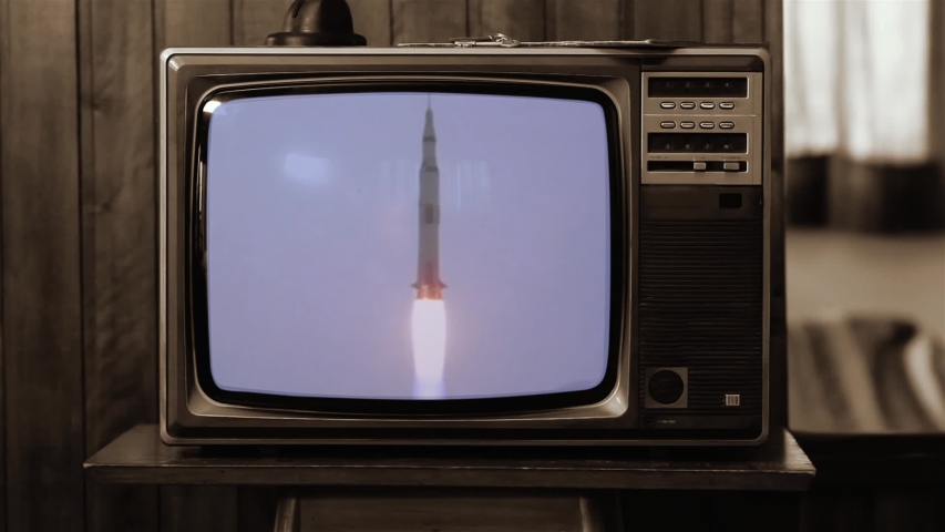 1969. Historical Footage of the NASA Apollo 11 Launch On an Old Retro TV. Sepia Tone. Elements of this video furnished by NASA.   Royalty-Free Stock Footage #1040151596