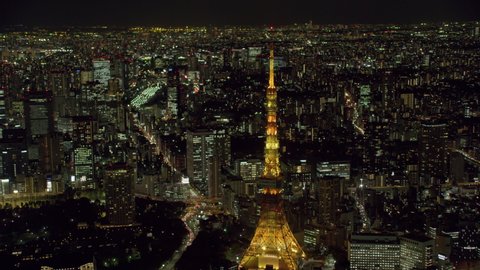 Tokyo, Japan circa-2018. Aerial view of Tokyo Tower at night. Shot from helicopter with RED camera.
