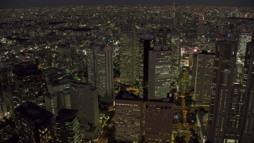 Tokyo, Japan circa-2018. Flying over city of Tokyo at night. Shot from helicopter with RED camera.