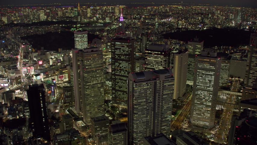 Tokyo, Japan circa-2018. Flying over city of Tokyo at night. Shot from helicopter with RED camera.