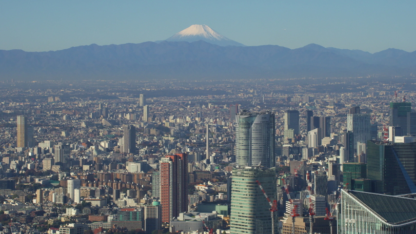 Tokyo, Japan circa-2018. Flying over Tokyo with view of Mt. Fuji. Shot from helicopter with RED camera.