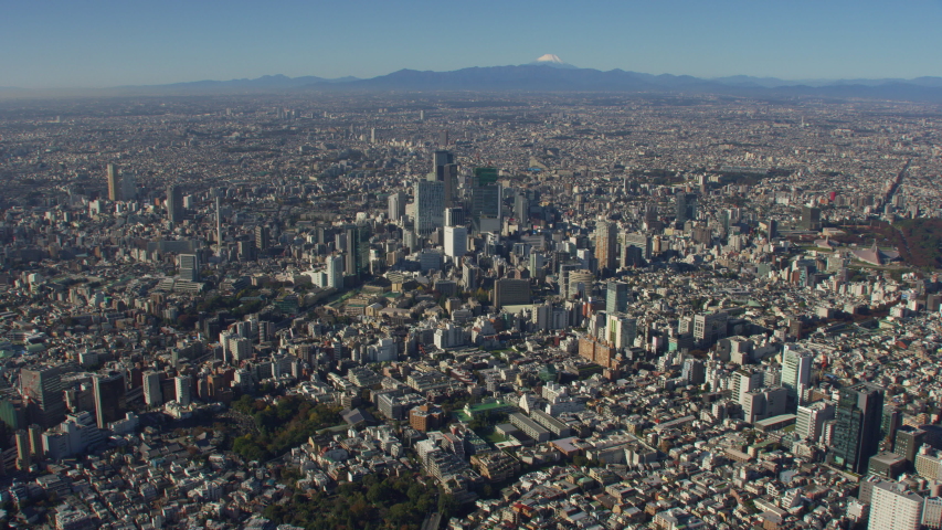 Tokyo, Japan circa-2018. Flying over Tokyo with view of Mt. Fuji. Shot from helicopter with RED camera.