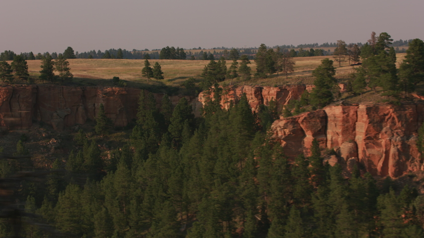 Driving by cliffs near Devils Tower, Wyoming