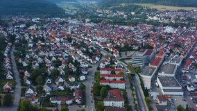 Aerial view of the city Tuttlingen. On a sunny day in summer. Pan to the right beside downtown.