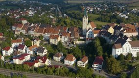 Aerial view of the city Engen in Germany. On a sunny day in summer. Pan to the left beside the city.