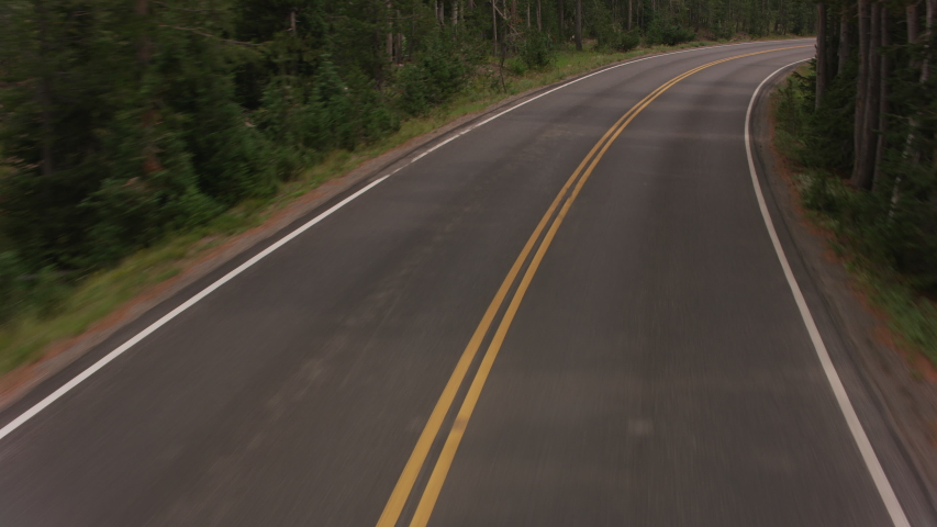 Driving along road by Yellowstone Lake, Yellowstone National Park