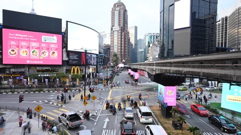 Kuala Lumpur, Malaysia, October 31, 2019. Time lapse video of traffic jam in a road intersection in Bukit Bintang. Bukit Bintang is the shopping and entertainment district of Kuala Lumpur, Malaysia. 