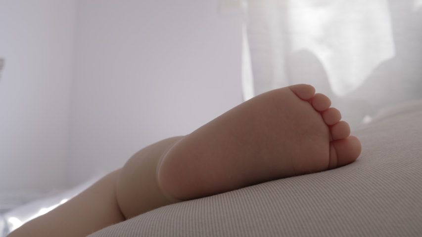 Close-up shot of little bare foot of sleeping baby | Shutterstock HD Video #1040180165