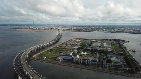 4K aerial early morning sunrise drone video of beautiful Gulf of Finland bay view of ZSD highway high-columns overpass bridge, St.Petersburg commercial port area in Russia's northern capital