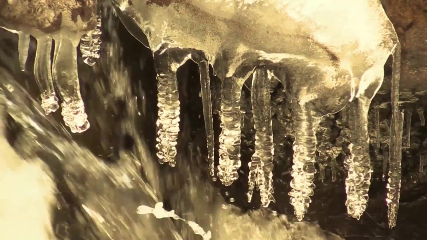 Close up of crystal waterfall water with ice.