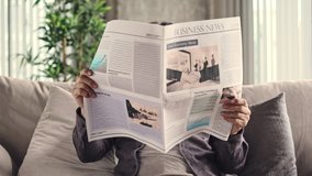 Senior man reading newspaper at home - Powered by Shutterstock - Get 15% off with code: PIKWIZARD15