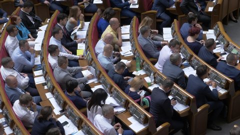 KYIV, UKRAINE - September 03, 2019: Ukrainian Parliament. Voting system of Verkhovna Rada. Deputies reading text of the law. Zeteam in parliament. First session after election.  New law. New session.