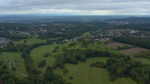 Aerial view of the city Schneidhain and Königstein im Taunus in Germany. On a cloudy day in autumn. Panorama view with slow zoom in.