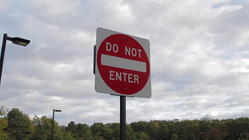 Slow move towards do not enter sign