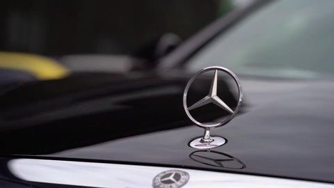 SAINT-PETERSBURG, RUSSIA - JULY 6, 2019: Luxury premium car rides on the road. Black Mercedes Benz W222 limousine sedan in town. Logo on hood