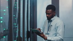 In big data center team of multi-ethnic IT server engineers inspecting working server computers. Man and woman technicians working together in high tech server rack room. - Powered by Shutterstock - Get 15% off with code: PIKWIZARD15