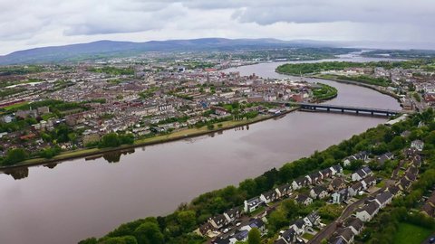 Aerial of beautiful Derry city and river Foyle flowing through the city in Northern Ireland