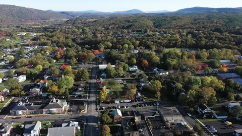 High aerial pull back showing the city of Romney in Hampshire County, West Virginia in autumn.
