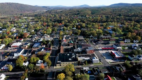 High aerial push in showing the city of Romney in Hampshire County, West Virginia in autumn.