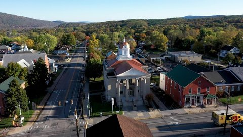 Trucking shot to right of Romney courthouse in Hampshire County, West Virginia in autumn.