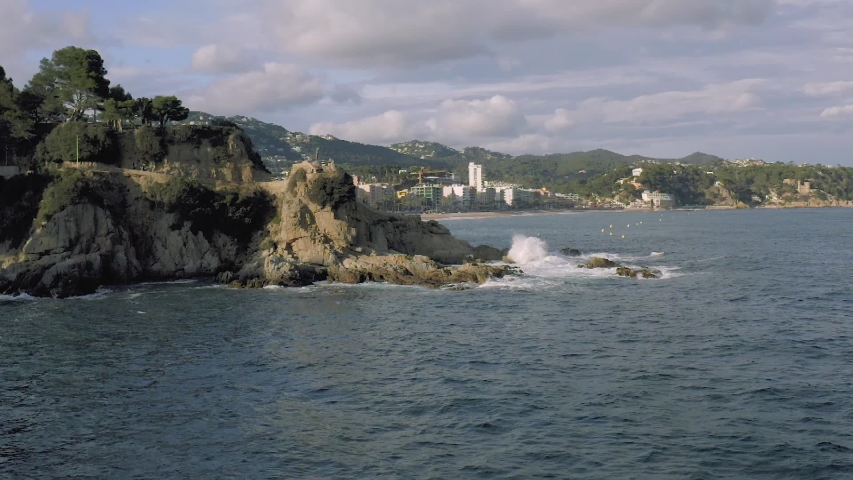 Lloret de Mar on Mediterranean Sea in summer Spain SLOWMOTION drone flight