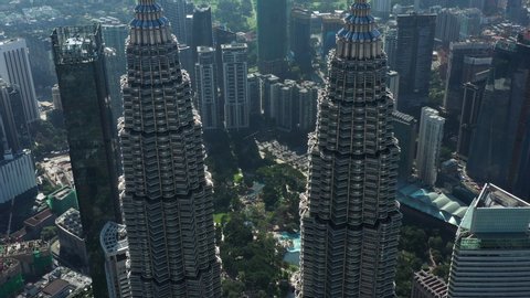 Kuala Lumpur, Malaysia, October 29, 2019. View from above, aerial view of the Petronas Twin Towers with the KLCC in the distance. The Petronas Towers are twin skyscrapers in Kuala Lumpur, Malaysia.