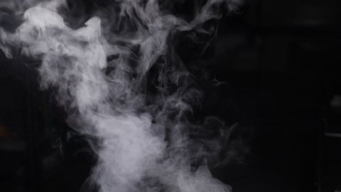 Fire Smoke from Bottom Up on Black Background. White vapor rising up. Dense smoke while cooking. Slow motion. hd