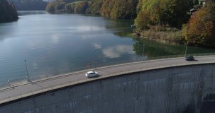 Cars drive on Rossens barrage - Aerial 4K