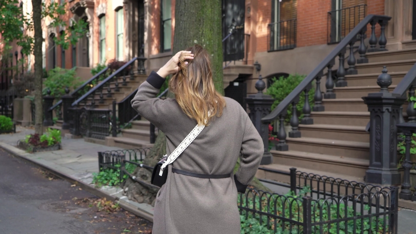 Young girl walking in a New York city midtown, soho district