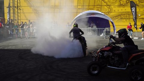 SAINT-PETERSBURG, RUSSIA - JULY 28, 2019: Burnout. Stunt riding motor show. Bikers on motorbike, bike, motorcycle and atvs competition