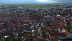 Aerial view of the city Gross-Umstadt im Odenwald in Germany. On a cloudy day in autumn. Descending beside the village.