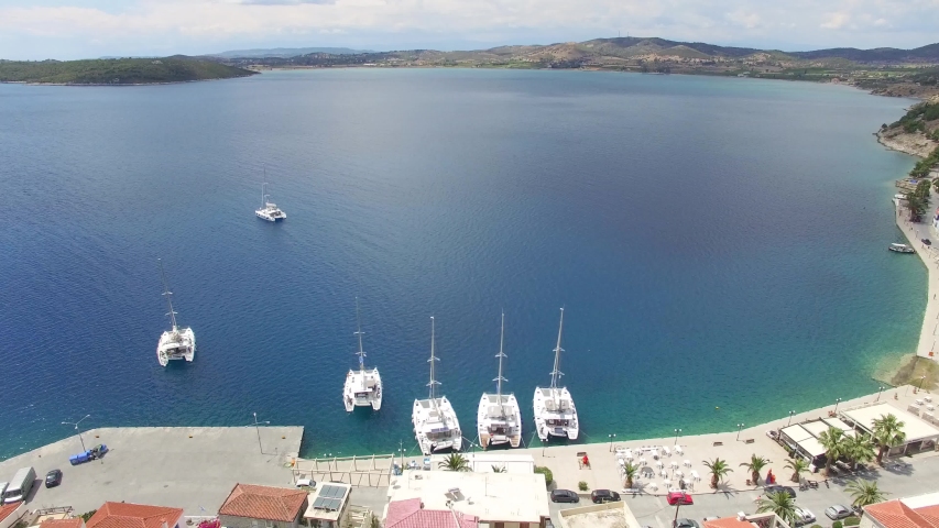 ?lose up view of yachts and hills in the sea bay. Lagoon and yachts. Aerial view of south coast.
