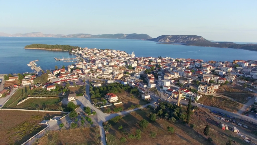 City coast top view. Aerial view of mountins surrounded by the sea and houses.
