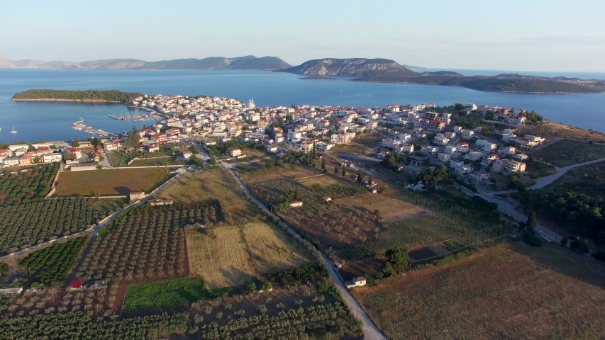 City coast top view. Aerial view of mountins surrounded by the sea and houses.