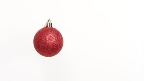 Christmas and New Year red Ball. Rotating decoration on white background. Merry Christmas and a Happy New Year! - Powered by Shutterstock - Get 15% off with code: PIKWIZARD15