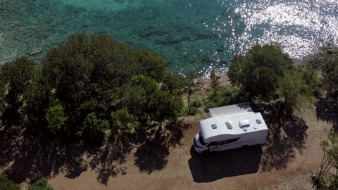 Aerial Footage of Scenic Sea. Modern Motorhome Van on the Mediterranean Sea Croatian Coast. Vacation on the Road. Turquoise Bay.