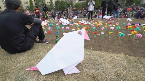Santiago, Chile - October 26, 2019 protest paper flowers and birds at Plaza de Italia in Santiago de Chile, Chile