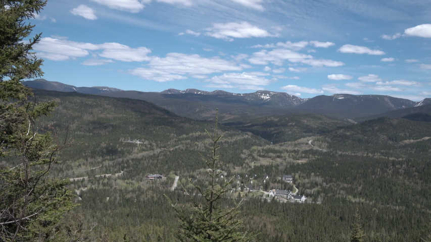 Panning shot overlooking wide valley in Gasperie, Quebec in Canada.