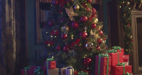 New Year 2020 mood, Christmas tree, happy holidays. Christmas gift box,   Christmas interior. Shot on Cinema Camera
