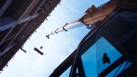 Telescopic arm of a mobile crane on building construction site