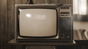 Historical Footage of the NASA Apollo 11 Moon Landing On an Old Retro TV. Sepia Tone. Elements of this video furnished by NASA. 