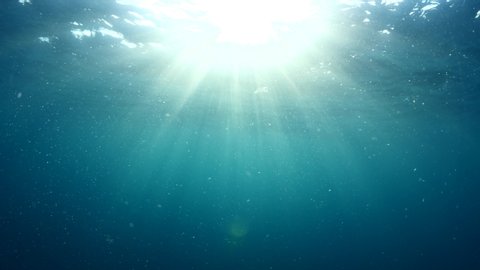 sun rays sun beams on the surface of the sea underwater sun shine relaxing ocean scenery backgrounds