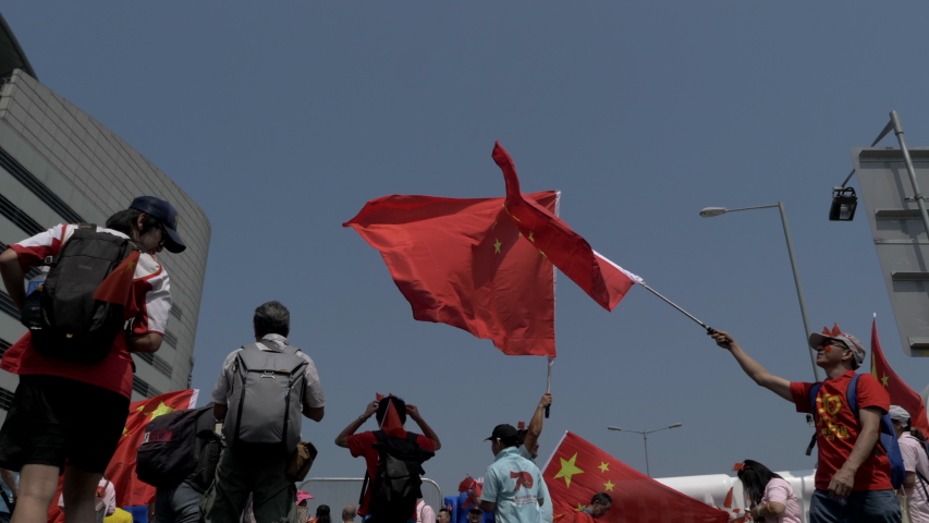 Hong Kong / China - 1 October 2019: Pro-Beijing tourist celebrating the National Day of the People