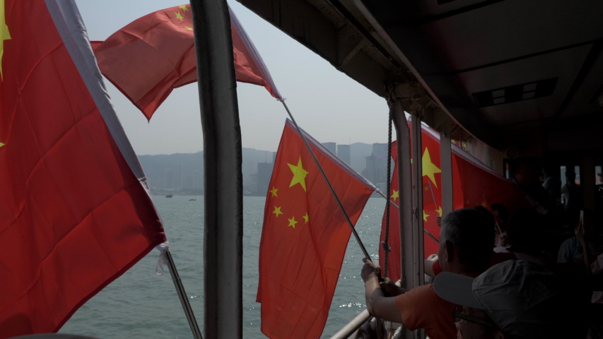 Hong Kong / China - 1 October 2019: Pro-Beijing tourist celebrating the National Day of the People