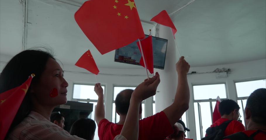 Hong Kong / China - 1 October 2019: Pro-Beijing tourist celebrating the National Day of the People