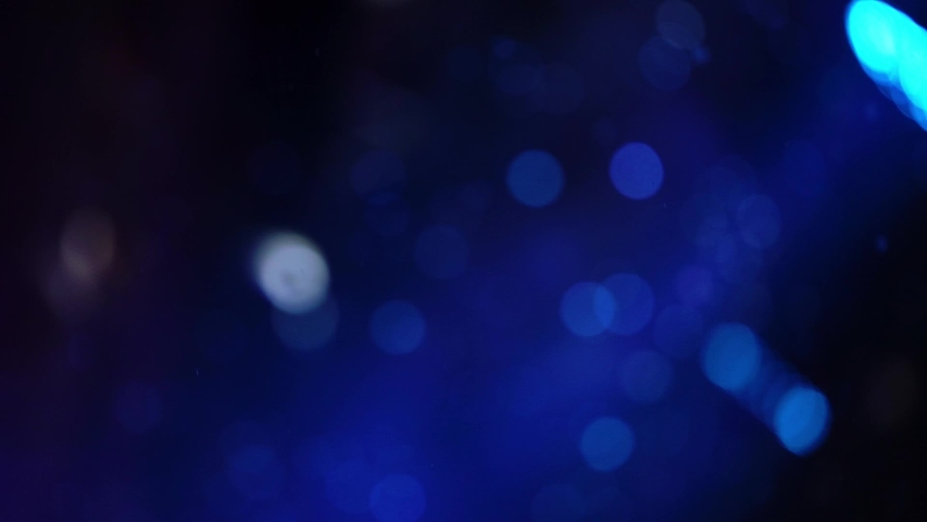 Confetti in the air explosion or soap bubbles at the party. Blurred abstract background