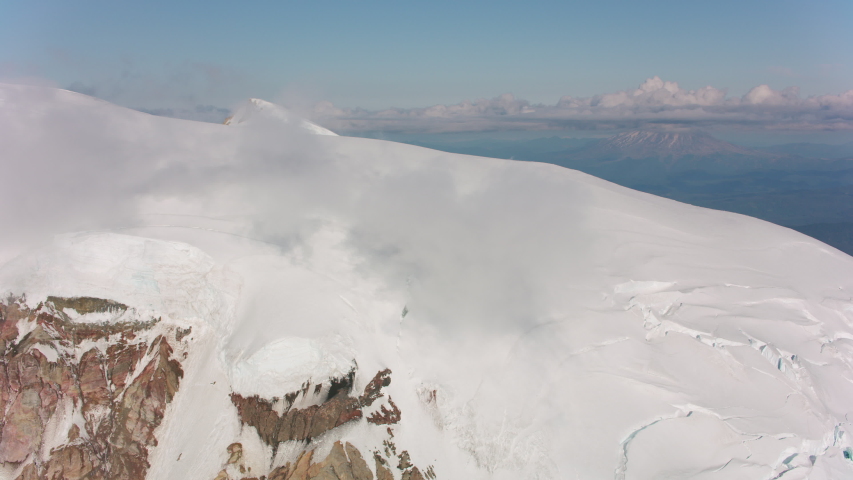 Mount Adams, Washington circa-2019. Aerial view of Mount Adams. Shot from helicopter with Cineflex gimbal and RED 8K camera.
